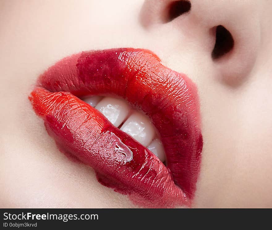 Closeup macro portrait of female part of face. Human woman lips with unusual alyapy beauty makeup. Girl with perfect lips shape