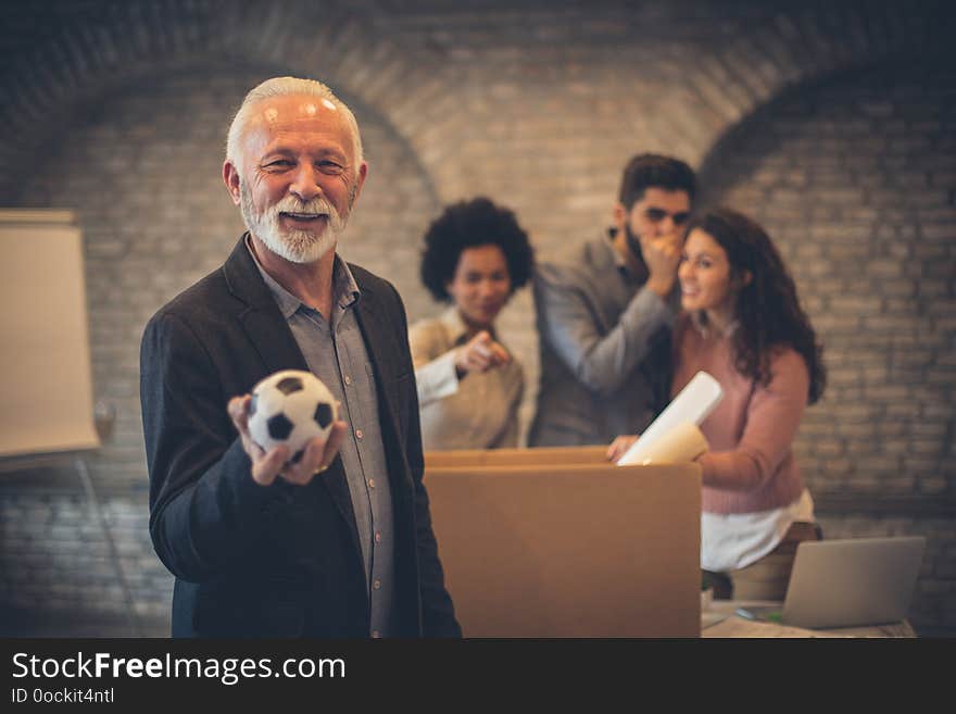 I am ready for change. Businesspeople in the office. Man holding football ball. Focus on man