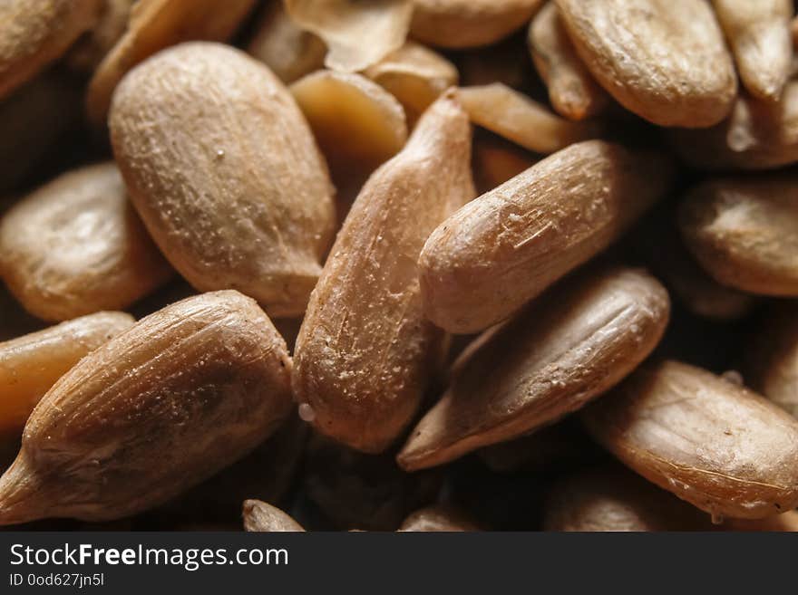 Peeled, roasted and salted sunflower seeds. Macro close-up photography.