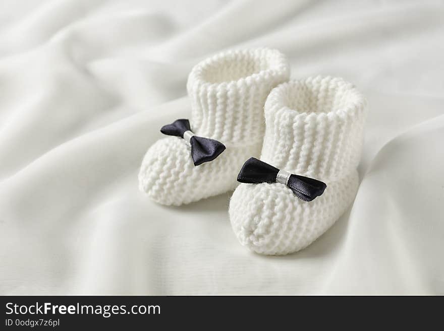 Handmade baby booties with bows