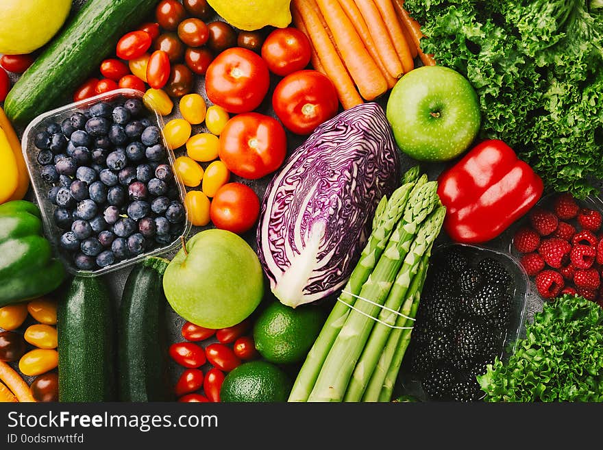 Different tasty vegetables on rough background