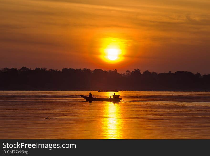 Long tail fisherman boat in Khong river