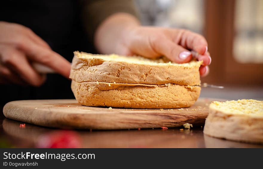 The pastry chef prepares a biscuit cake in home kitchen or in a restaurant. The concept of the process of making cakes