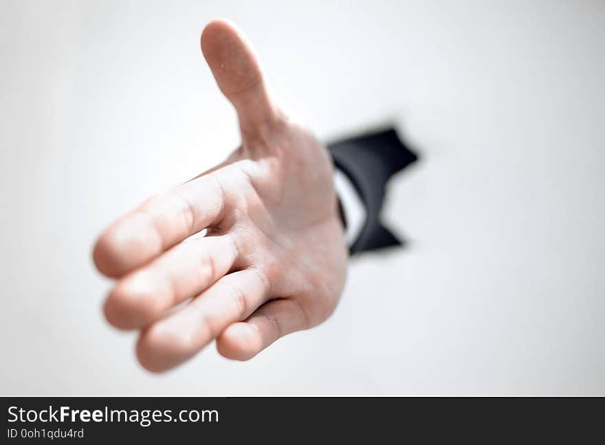 Close up. businessman holding out his hand for a handshake.photo with copy space