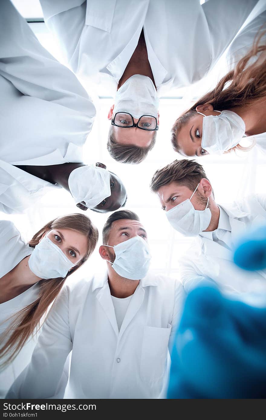 Surgical team working on a bleeding patient in a surgical room. Surgical team working on a bleeding patient in a surgical room