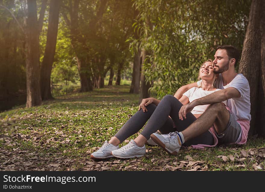 A lovely couple cuddling in a park