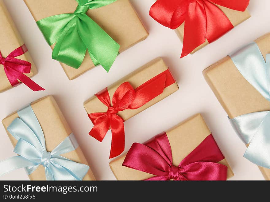 Gifts packed with craft paper and colorful satin ribbons