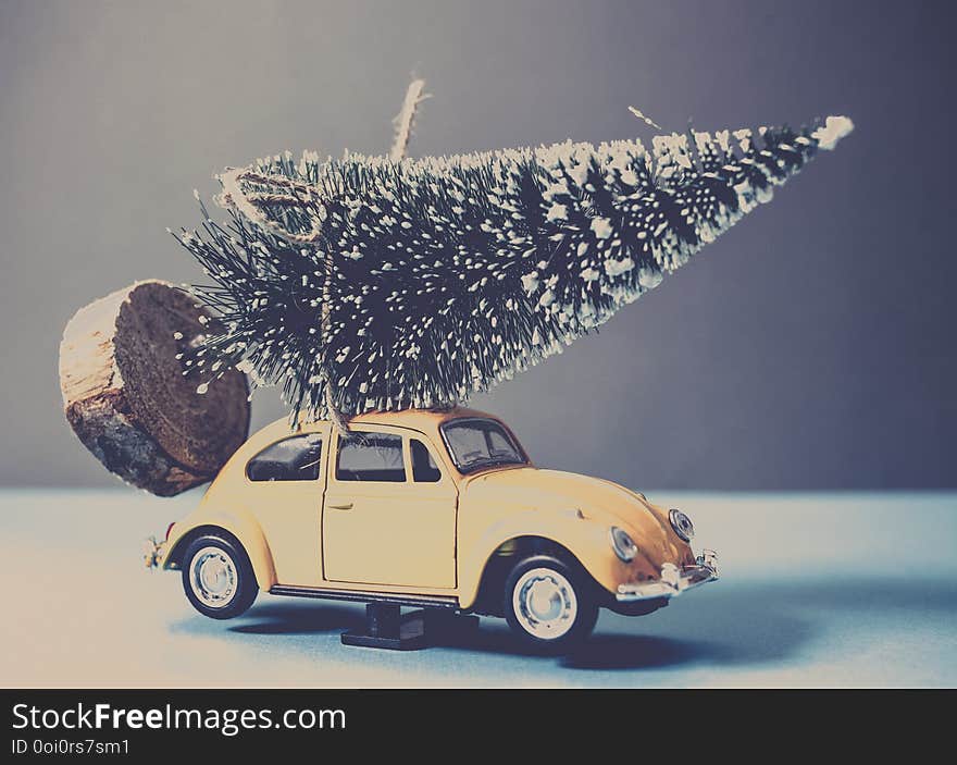 christmas tree on yellow toy car