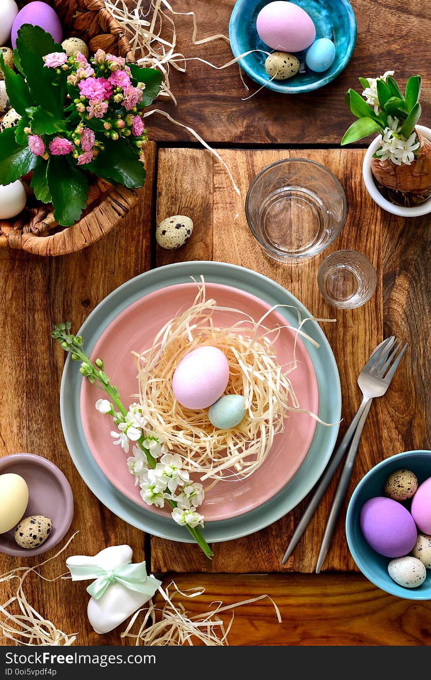 Easter table setting, holiday table home decor idea, flat lay composition with cutlery, Easter eggs and fresh flowers. Easter table setting, holiday table home decor idea, flat lay composition with cutlery, Easter eggs and fresh flowers