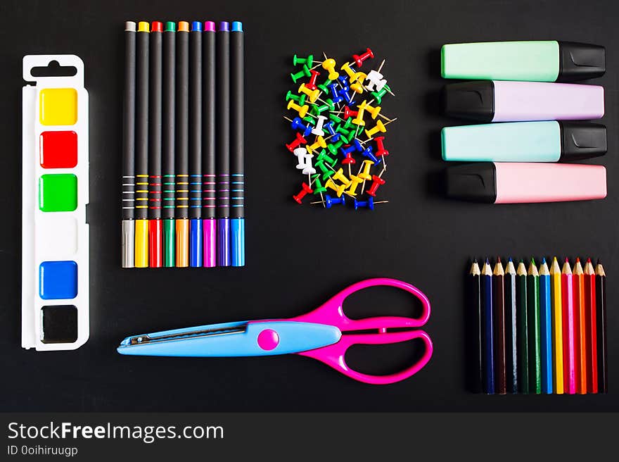 Different School Accessories Over Blackboard Background