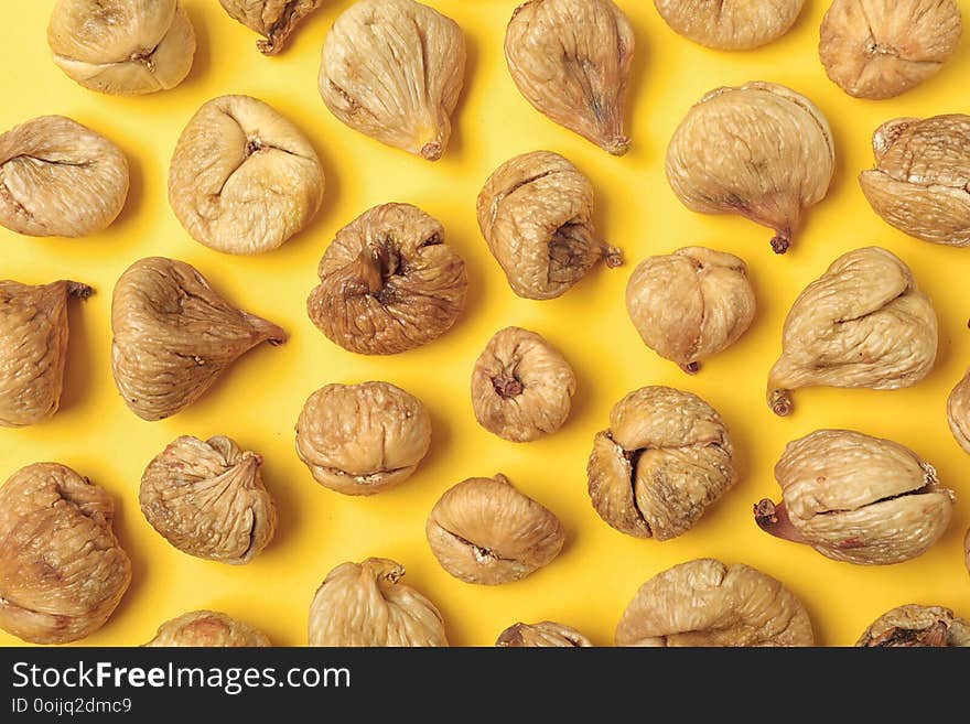 Flat lay composition with dried figs on color background.