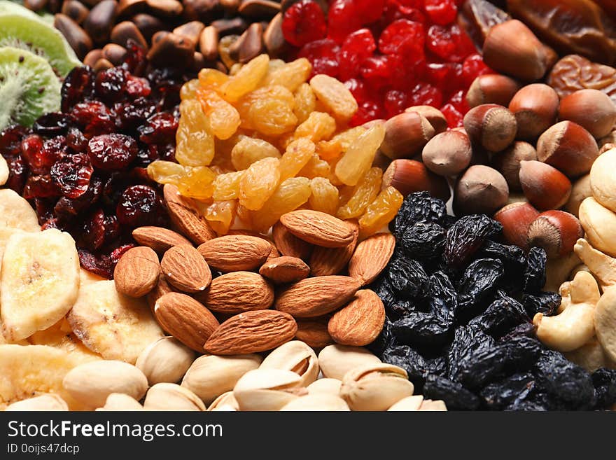 Different dried fruits and nuts as background, closeup