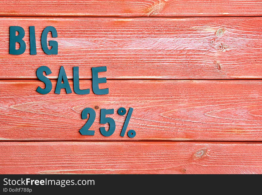 Big sale lettering and discount offer at 25 percent, metal letters on textured wooden boards color season 2019, close up, top view, flat lay. Big sale lettering and discount offer at 25 percent, metal letters on textured wooden boards color season 2019, close up, top view, flat lay