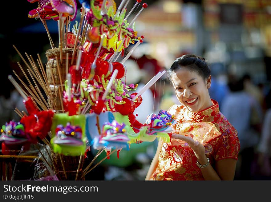 Asian woman wearing chinese tradition clothes toothy smiling face in yaowarat chinatown bangkok thailand