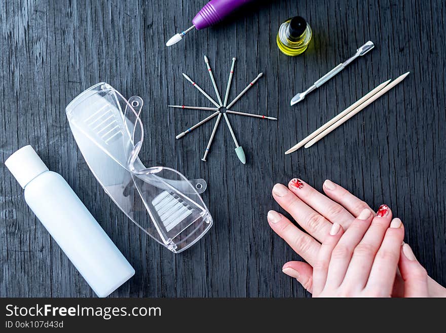 Tools For Professional Hardware Manicure And Women`s Hands On Dark Background