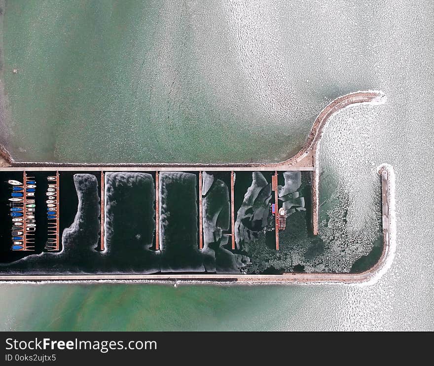 Boats frozen in the water on lake Balaton, Hungary