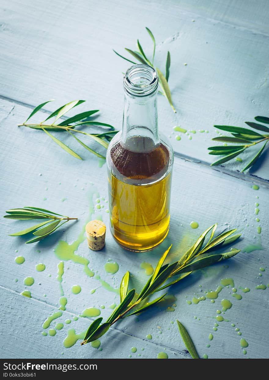 Olive oil with olive twig