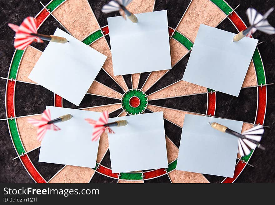 Office stickers on the dart board, close-up, copy space