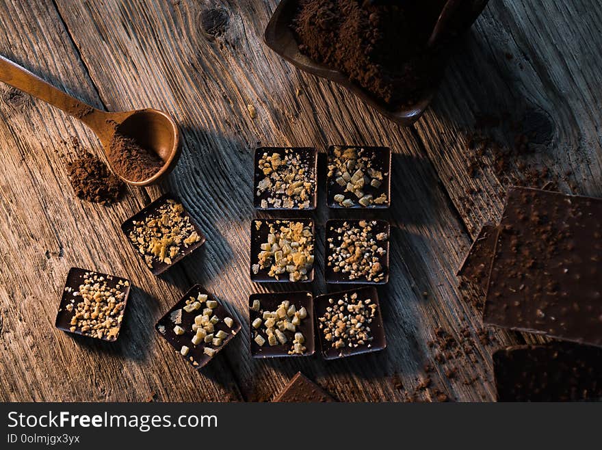 Composition of  Chocolate made at home, rustic woodenbackground.