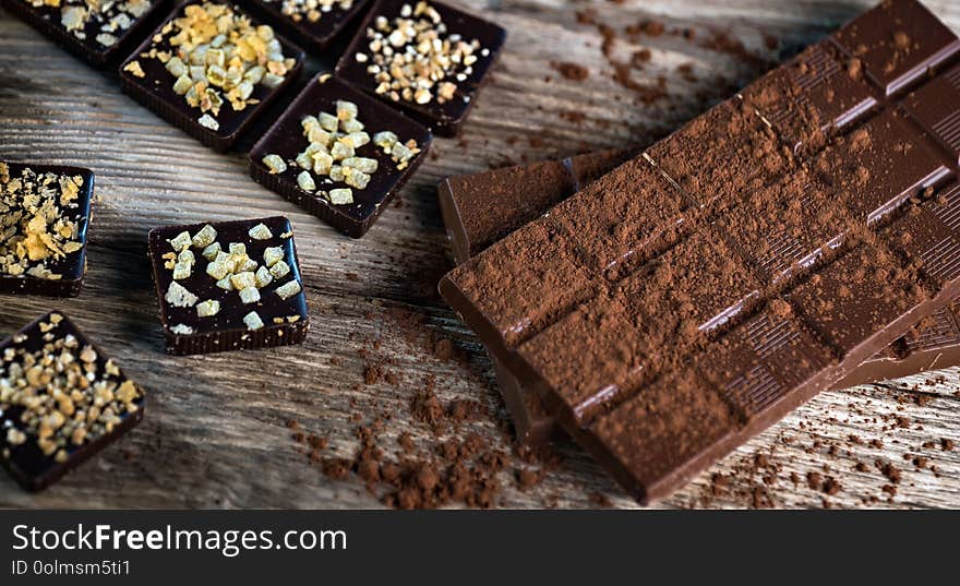 Composition of  Chocolate made at home, rustic woodenbackground.