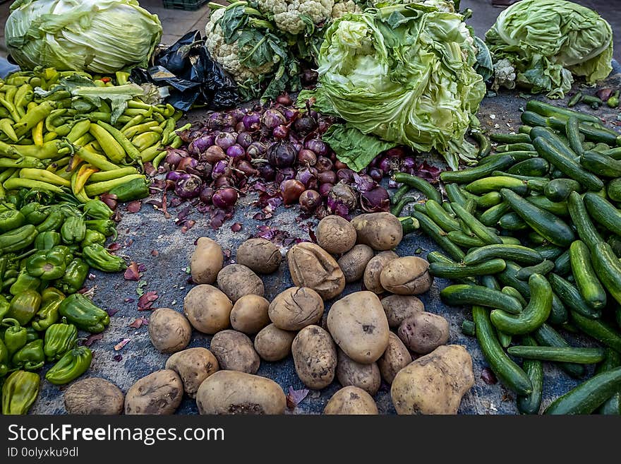 Plastic boxes with fresh vegetables on the counter of the Arab market