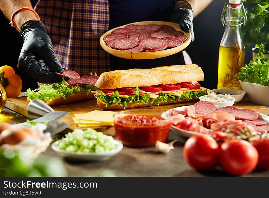 Takeaway Chef Preparing Baguette Sandwiches