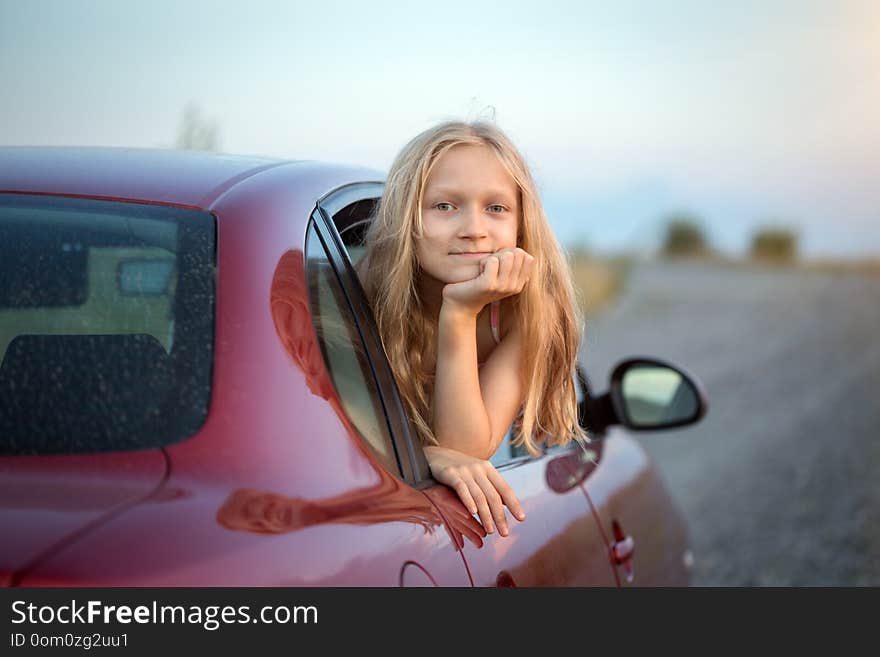 Girl looking out the car