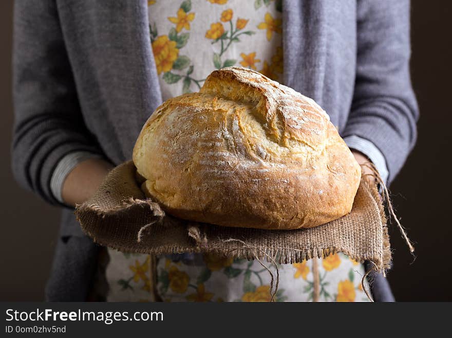 Girl holding fresh white bread