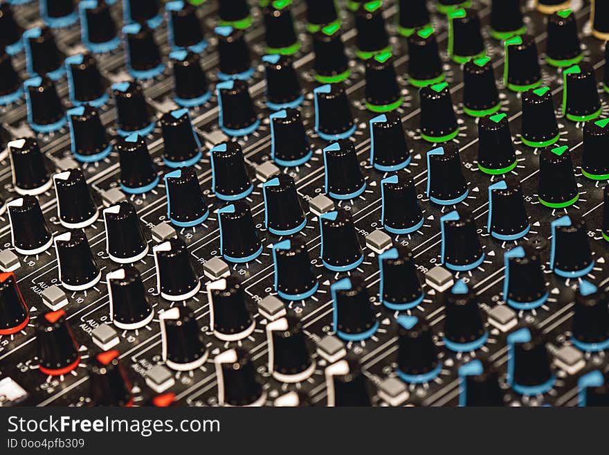 Professional Sound Mixer. Close-up view of colorful control buttons for sound adjusting in a recording studio. Sound equipment. Music record service