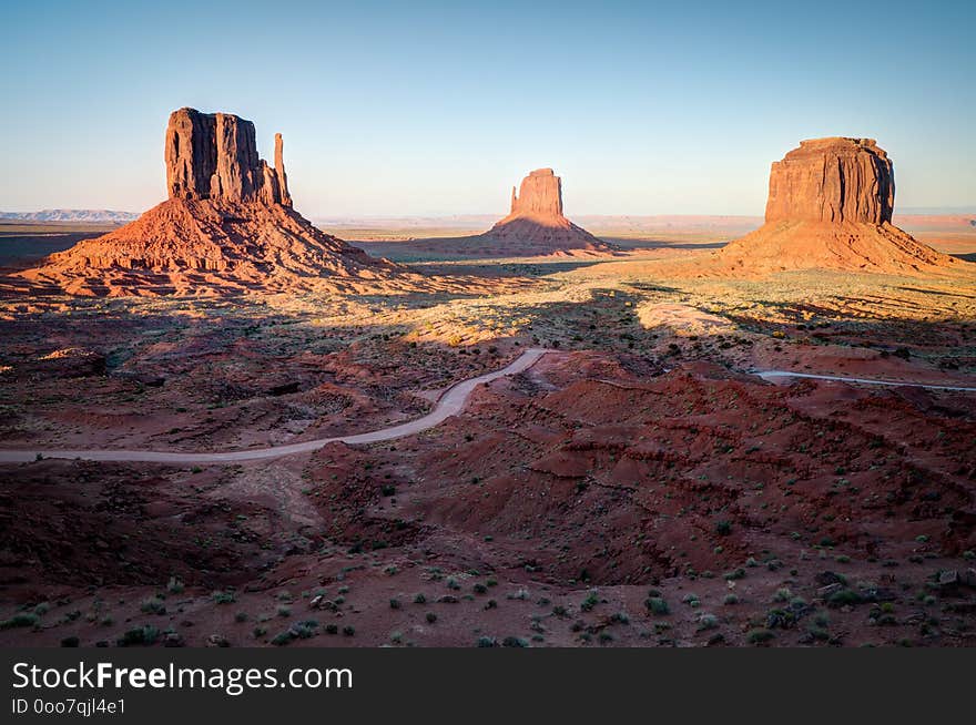 Sunset view looking out over Monument Valley on the Utah Arizona Line. West and East Mitten Butte. Merrick Butte. Sunset view looking out over Monument Valley on the Utah Arizona Line. West and East Mitten Butte. Merrick Butte.