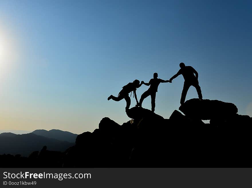 Help of climbers in the rocky region on top of mountains