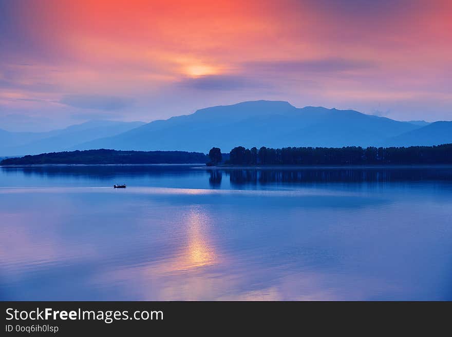 Beautiful sunset.Sun, lake.Sunset, sunrise landscape,panorama of beautiful nature. Blue Sky,amazing colorful clouds.Background.