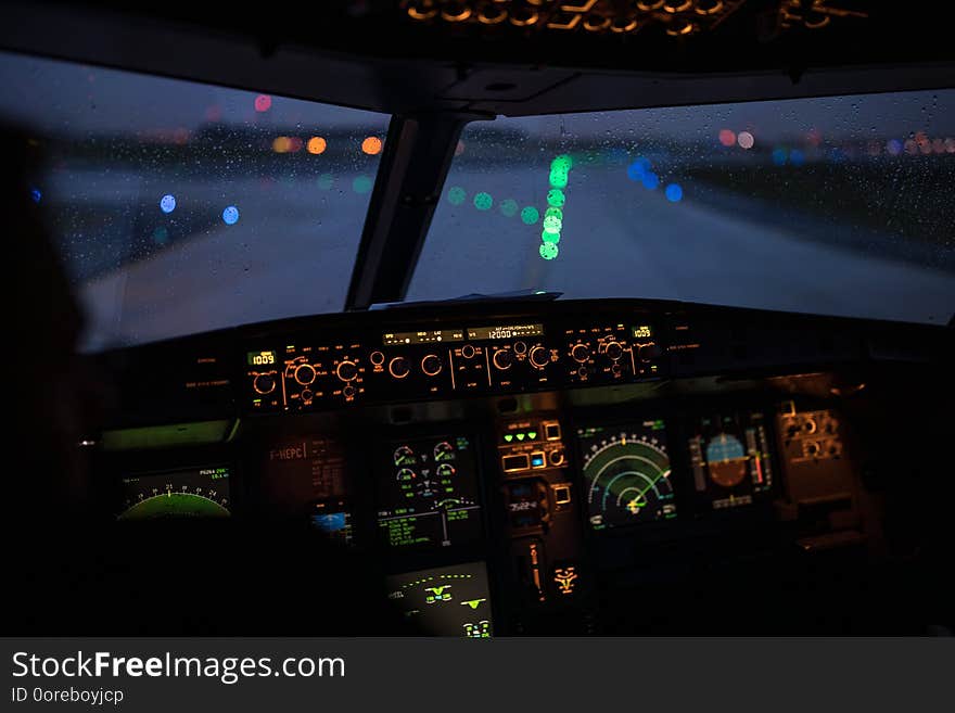 Pilot`s hand accelerating on the throttle in a commercial airliner airplane flight cockpit during takeoff. Pilot`s hand accelerating on the throttle in a commercial airliner airplane flight cockpit during takeoff