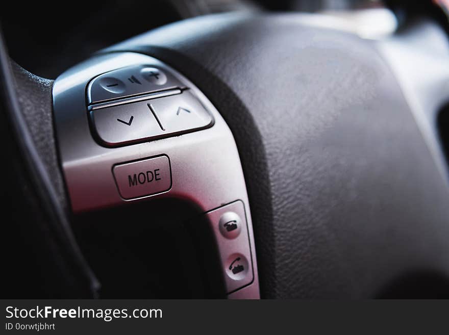 Close up steering wheel with control buttons close-up. Car stereo system control Is a general illustration