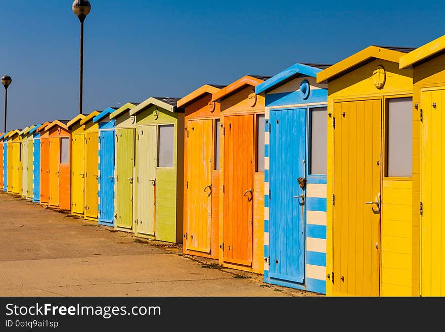 Wooden public change rooms on the beach. Colorful change rooms. Holiday concept.