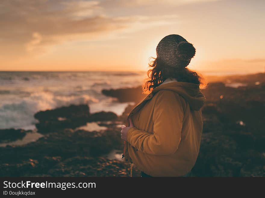 Girl in autumn by the sea