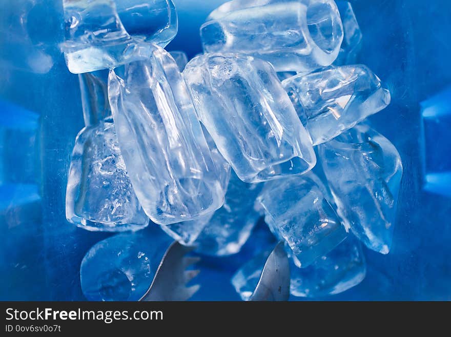 Ice cube in blue plastic basket. Thai local restaurant serving style