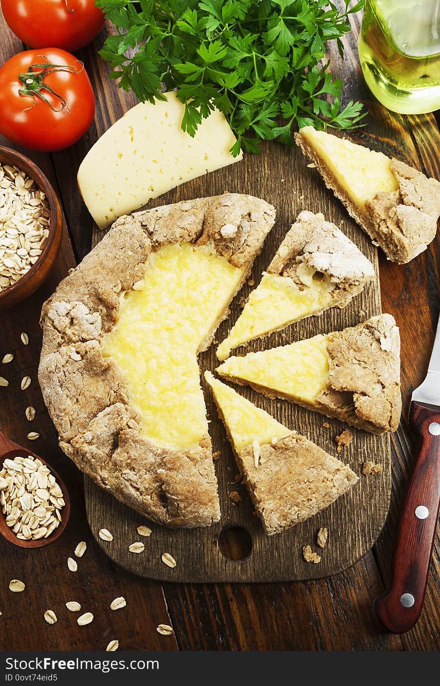 Galetta with oat flakes and cheese on the table