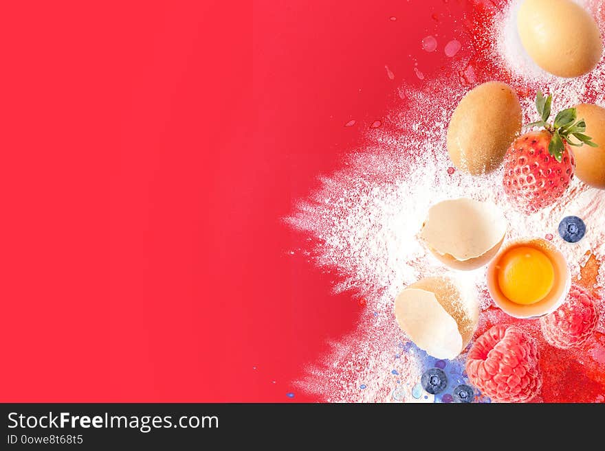 Cooking ingredients for muffins, cookies, dough and pastry. Photomontage Flat lay with eggs, flour, sugar and berries