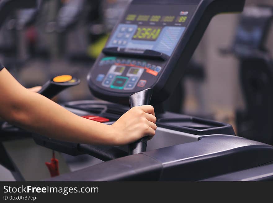 Fitness woman running on treadmill and burn fat in the body in the gym, Healthy lifestyle and sport concept.