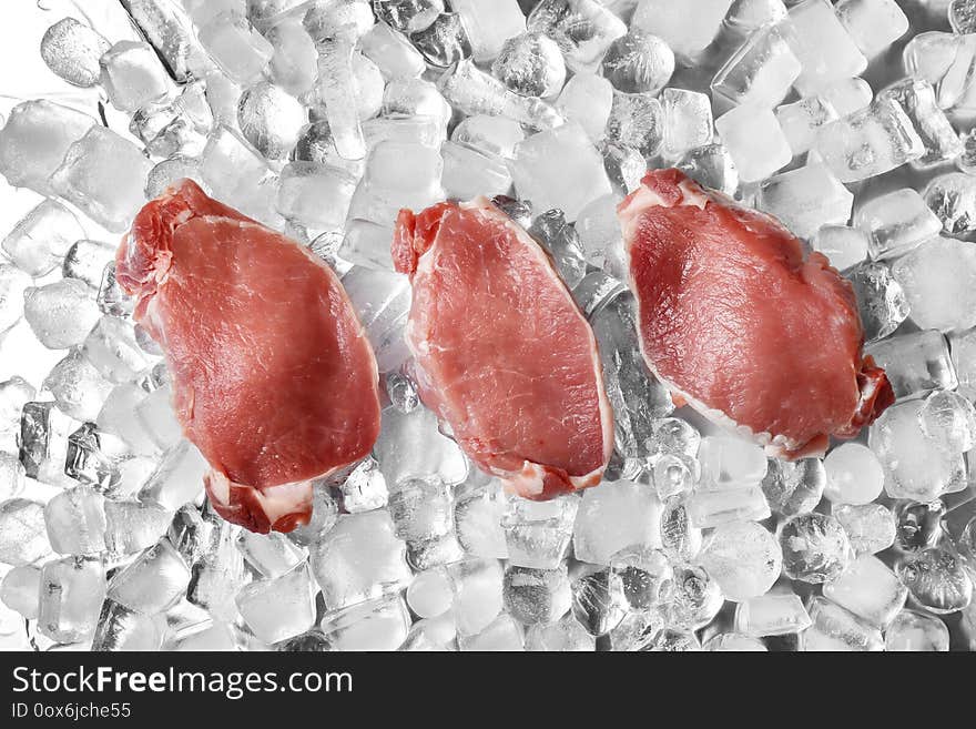 Fresh raw meat on ice cubes