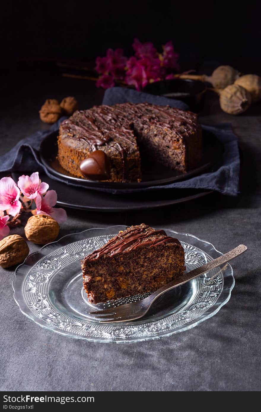 A juicy poppy seed cake with apples and chocolate glaze