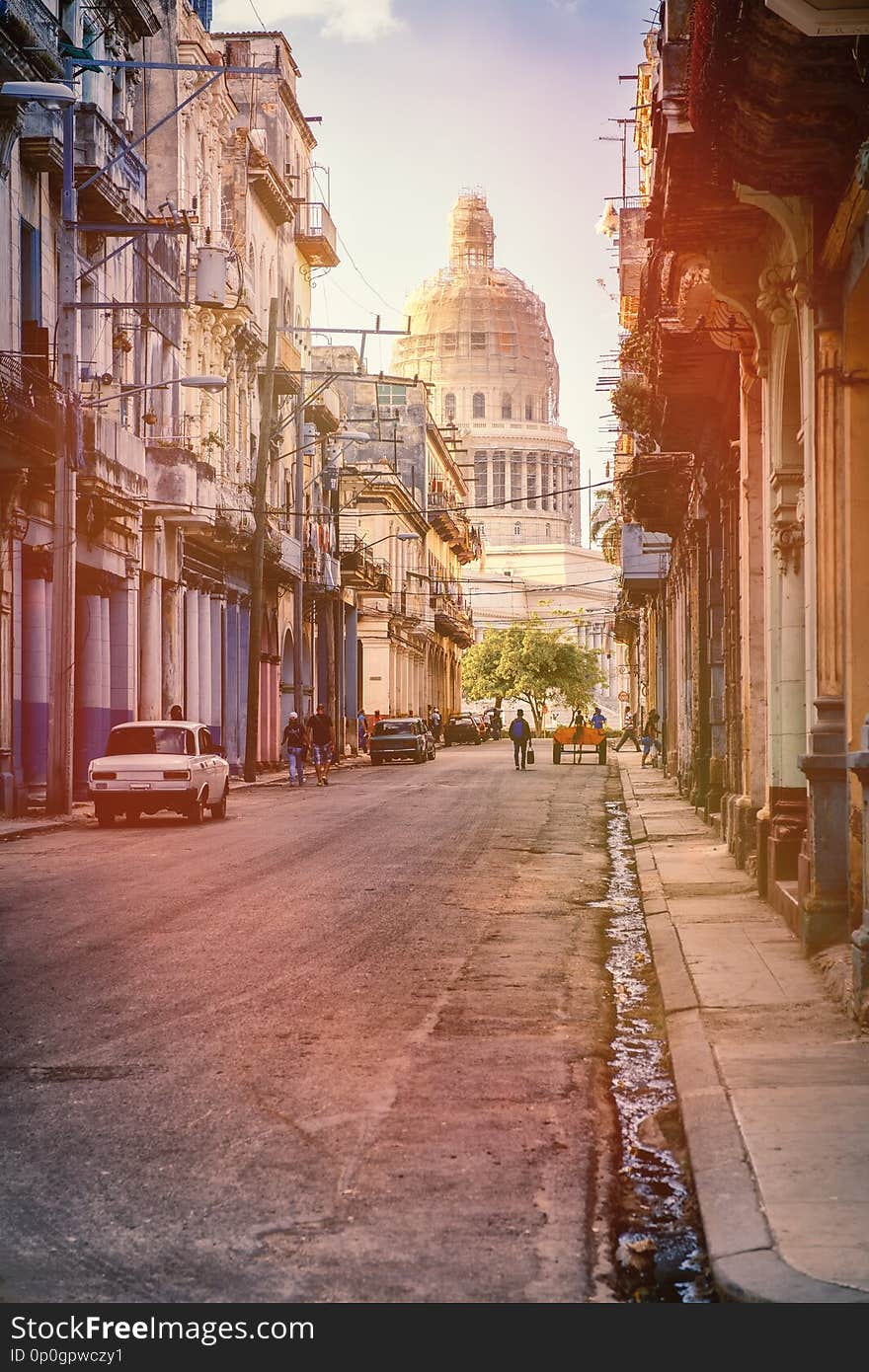 Street Scene In Havana With Old Buildings And The Capitol