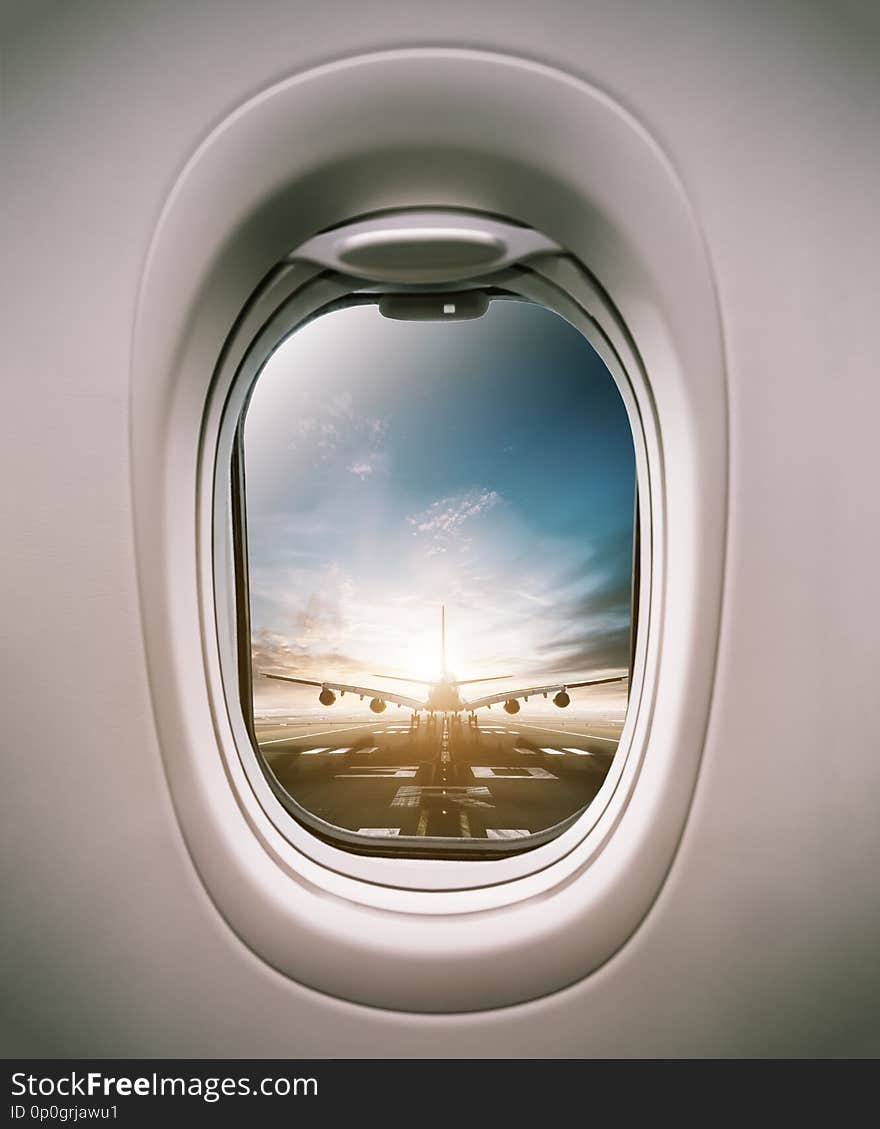 Airplane Window View To Runway With Huge Airplane