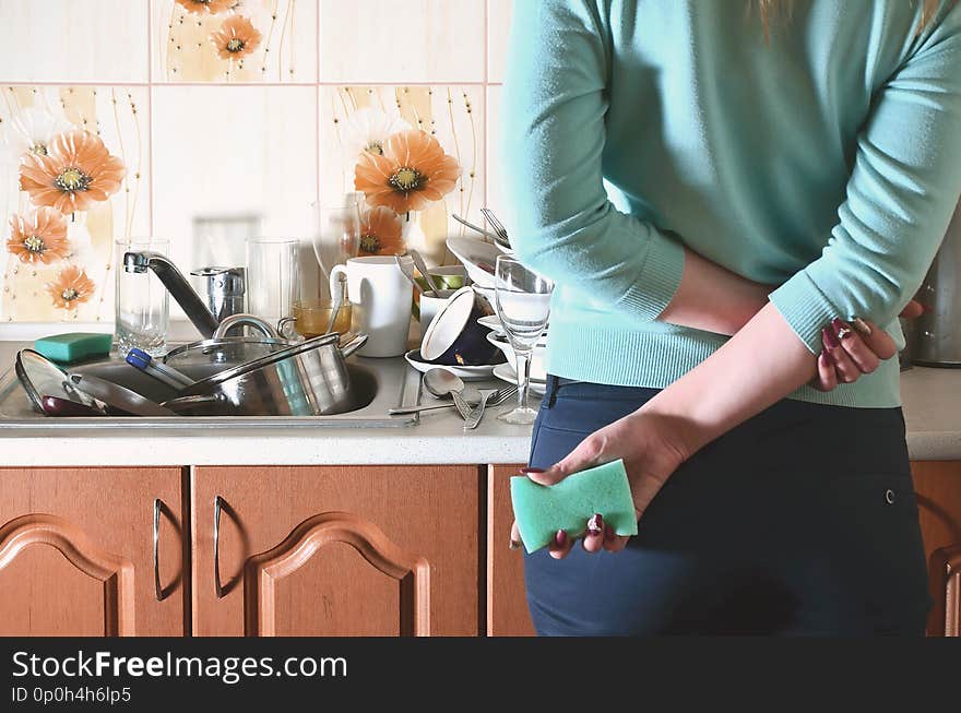 Fragment of the female body at the kitchen counter, filled with