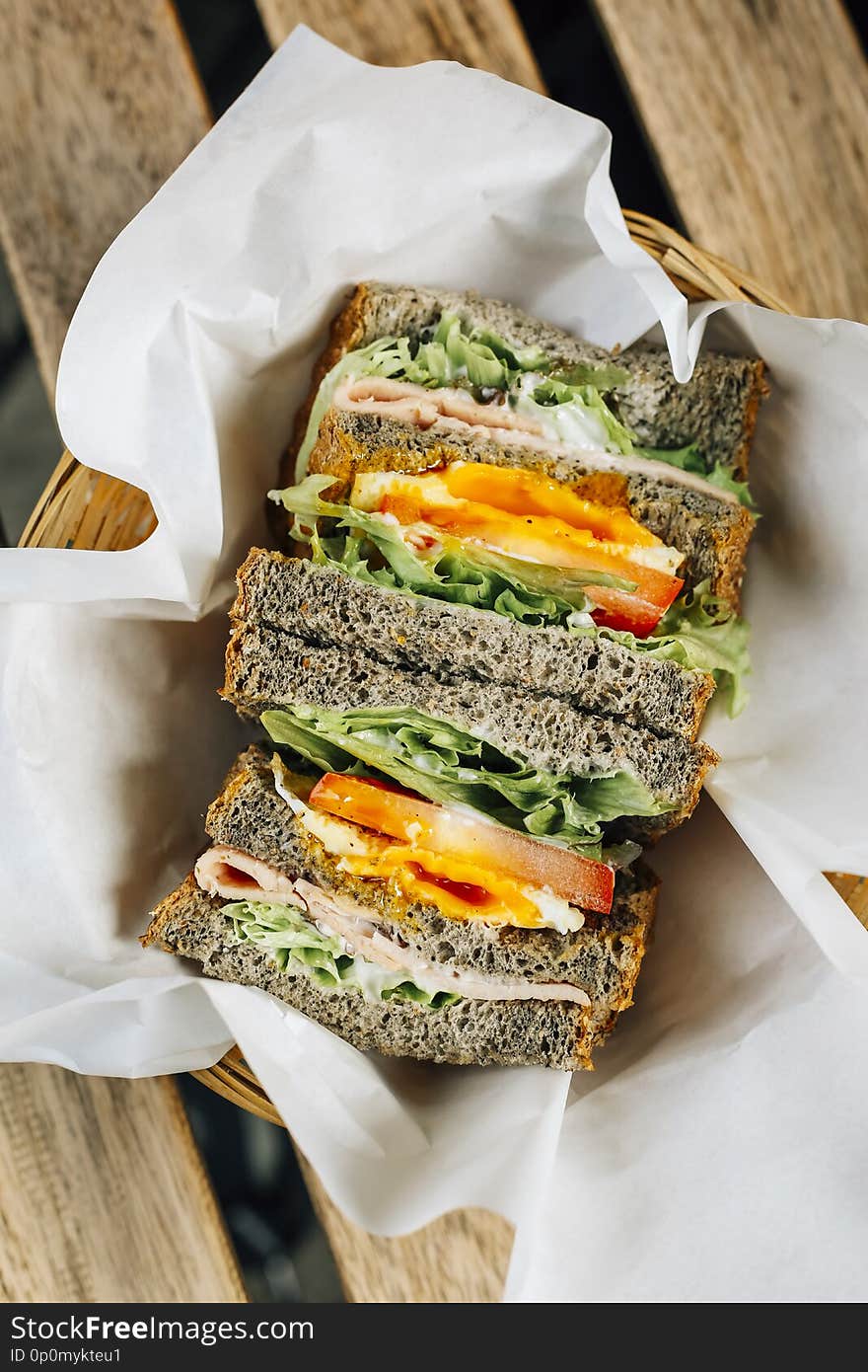 Black Sesame Toast Sandwich. Bread with chicken, egg and vegetables, a healthy style breakfast