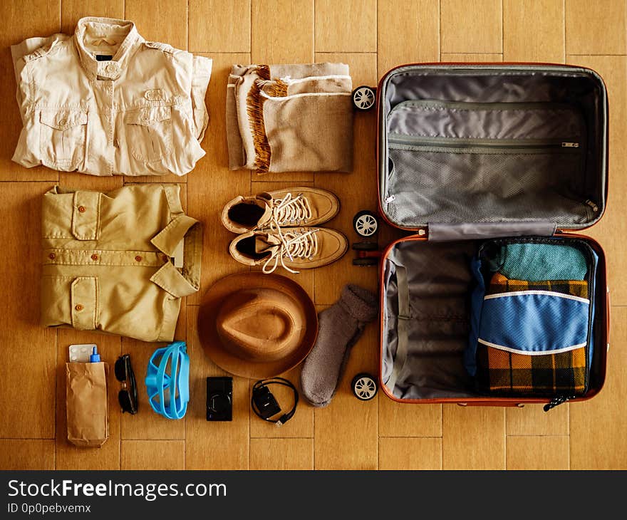 Open suitcase packed for travelling