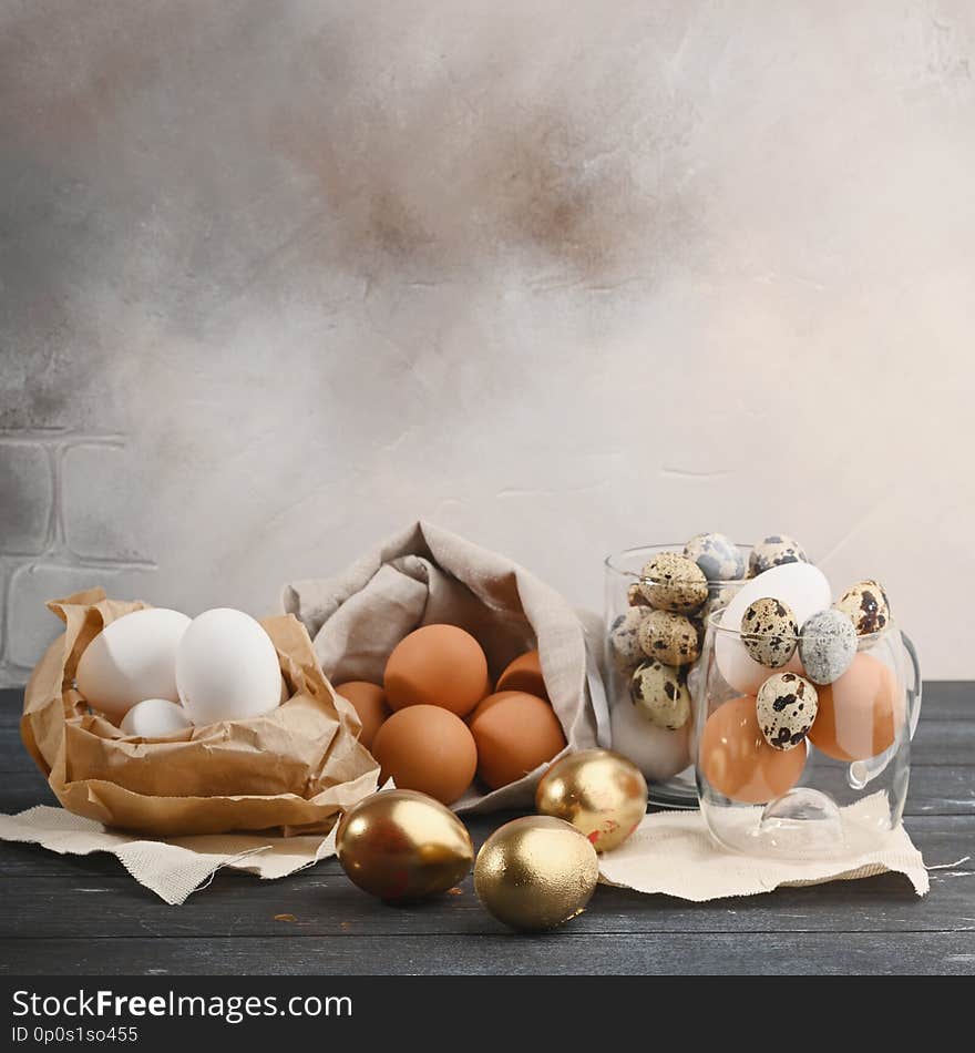 Quail eggs in glass container, white in paper and yellow in canvas bag and gold eggs. Quail eggs in glass container, white in paper and yellow in canvas bag and gold eggs.