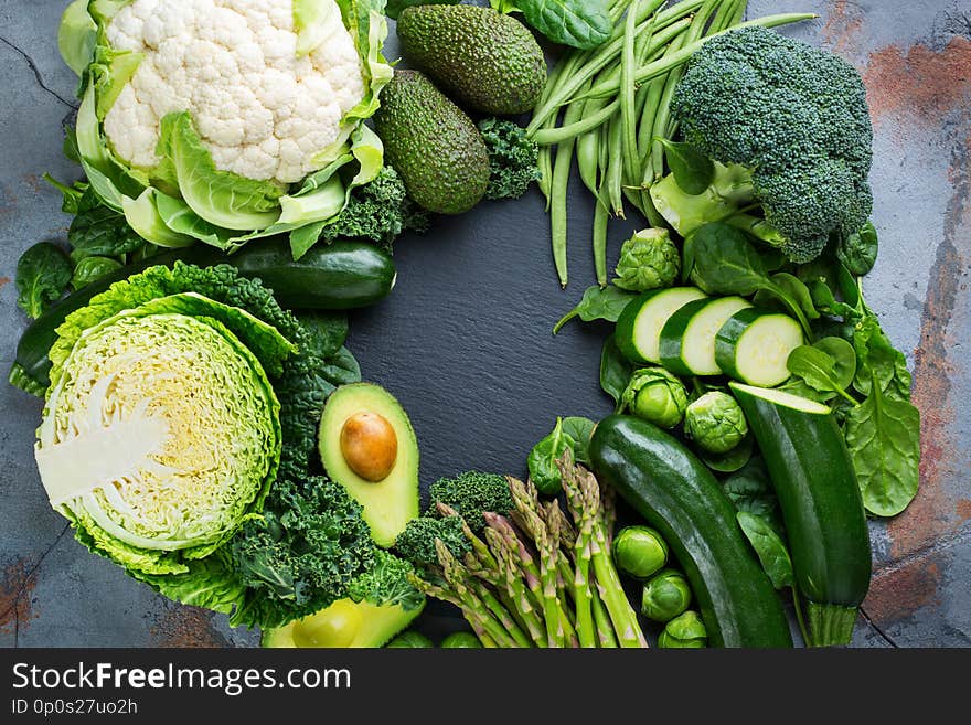 Assortment of healthy organic green vegetables for balanced eating. Vegan, vegetarian, whole food, plant based, clean eating concept. Top view flat lay copy space background. Assortment of healthy organic green vegetables for balanced eating. Vegan, vegetarian, whole food, plant based, clean eating concept. Top view flat lay copy space background