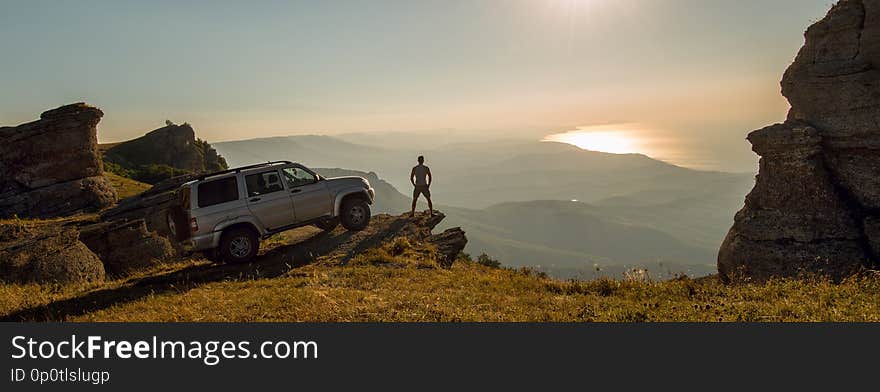 Man with car on beauty nature landscape background